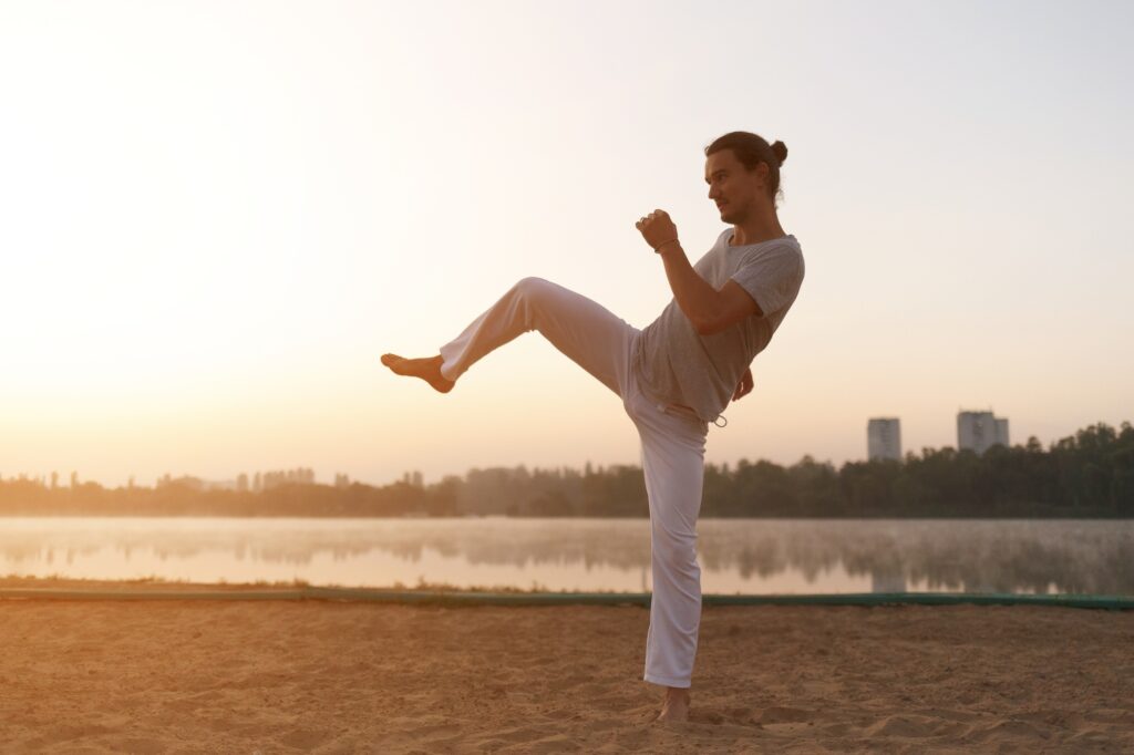Athletic man workout on the sunrise